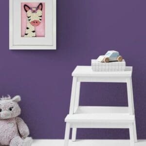 A cozy children's room corner with a purple wall, a stuffed hippo, and a white step stool.